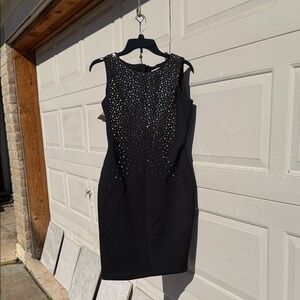 Elegant Black Sleeveless Dress with Sequin Design